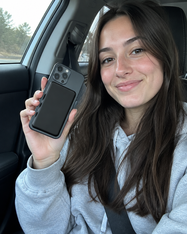 magnetic power bank on a phone in the car